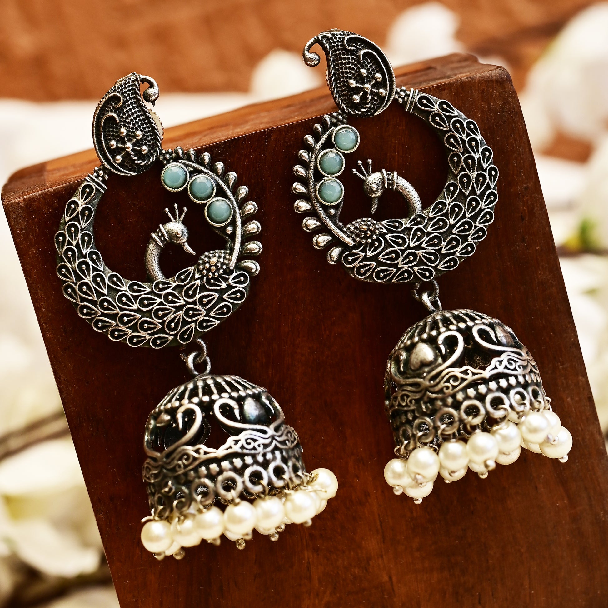 MORNI - Peacock & Lakshmi Pearls Embellished Intricate Jhumka Earrings